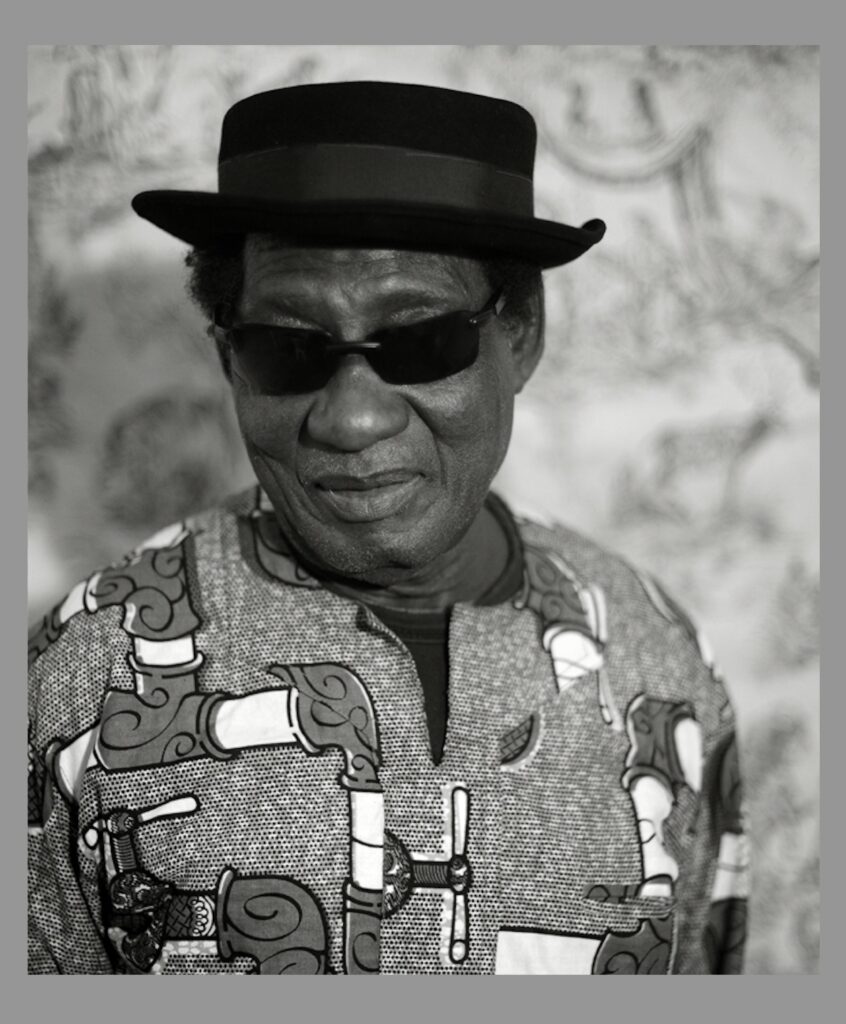 Ebo Taylor, 2013 - Foto: Sylvain lasco, https://commons.wikimedia.org/wiki/User:Sylvain_lasco - Lizenz: https://creativecommons.org/licenses/by-sa/4.0/deed.en - Datei: https://commons.wikimedia.org/wiki/File:Ebo_Taylor.jpg